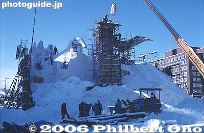 The reinforcement beams are covered with snow. A crane is used to carry the snow to high places.
Keywords: hokkaido sapporo snow festival