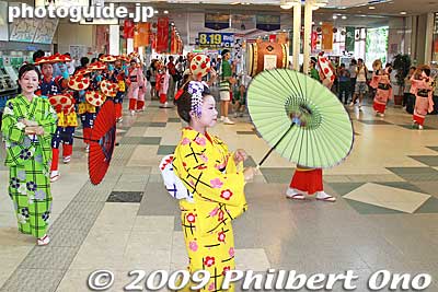 They dance to the beat of taiko drums and the prerecorded folk tune of Hanagasa Ondo singing, "Yassho, makasho!" 
Keywords: yamagata hanagasa matsuri festival tohoku flower hat dancers woman girls women kimono
